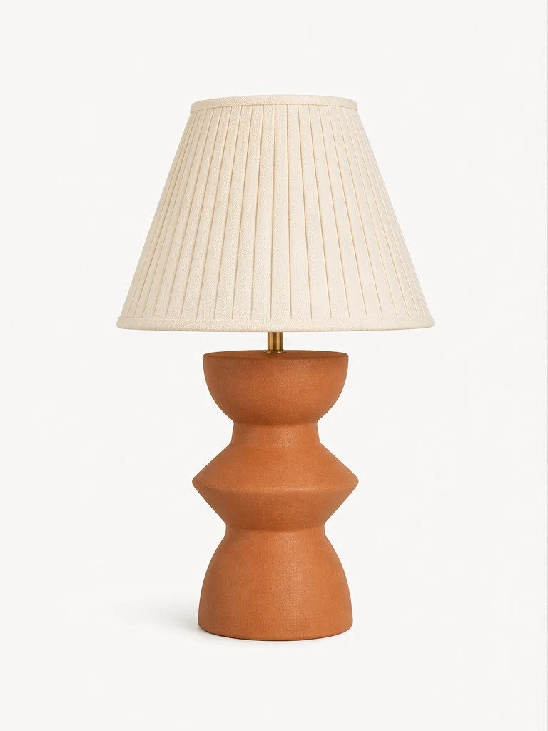 Original sculptural terracotta lamp on a clean studio background.